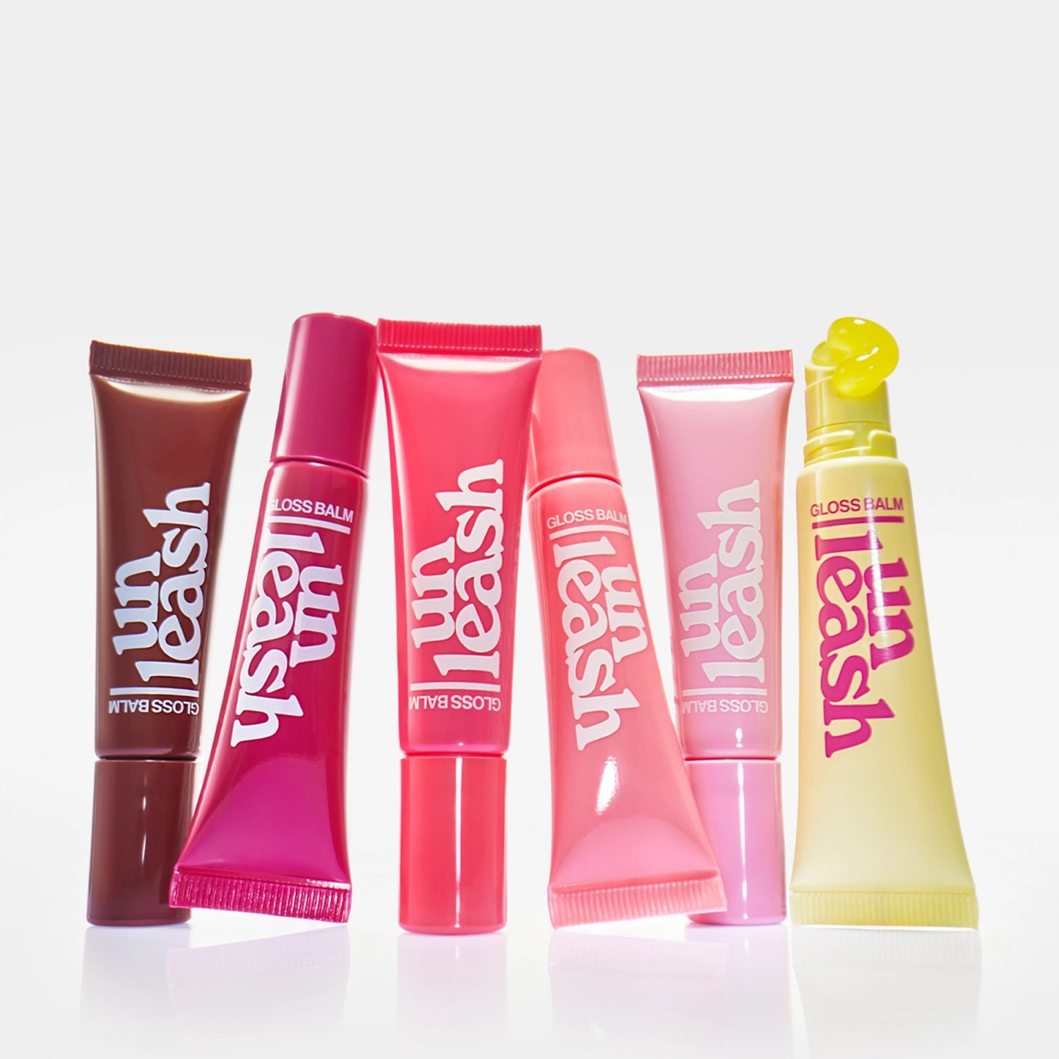 UNLEASHIA Sunset Dazzle Gloss Balm lūpų balzamas